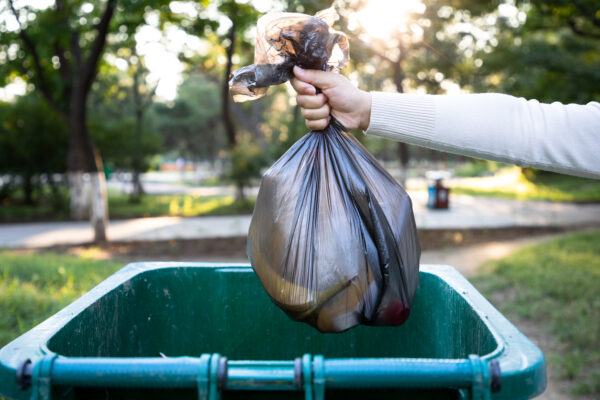 Person throwing away garbage