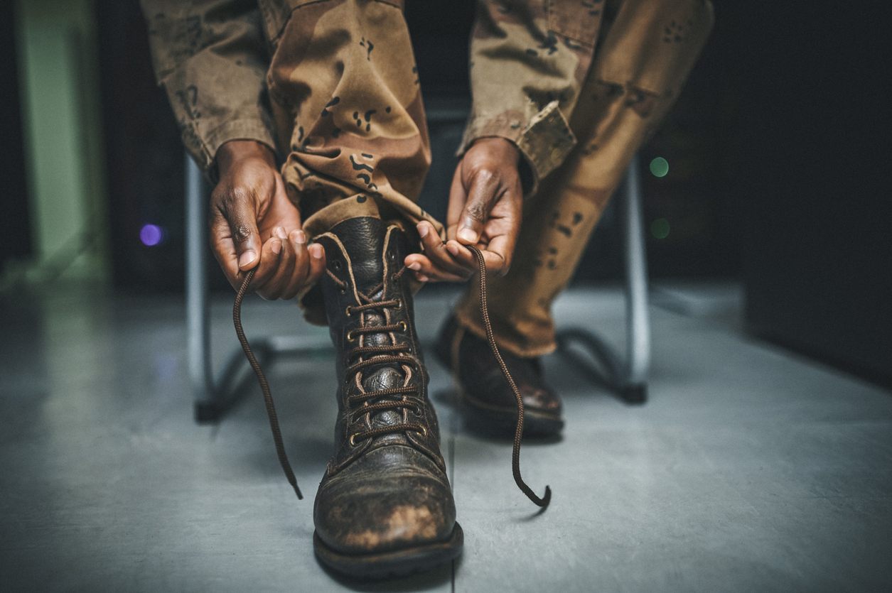 Soldier preparing his boots