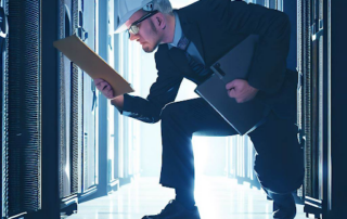 Inspector with clipboard in server room