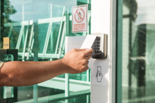 Employee using keycard to enter a secure building