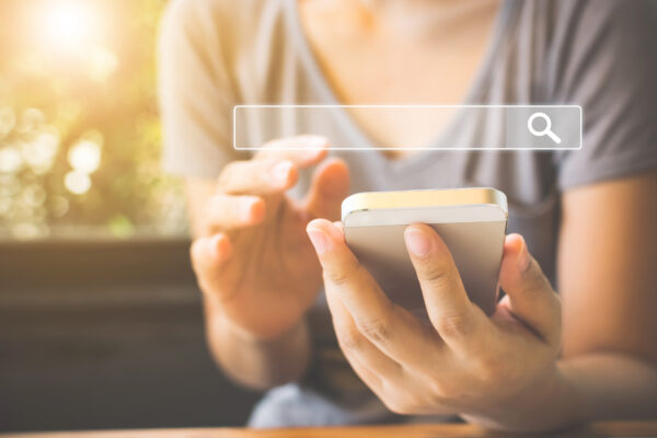 Women using smartphone to search information