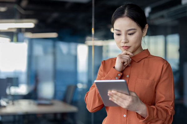 Focused women looking at tablet