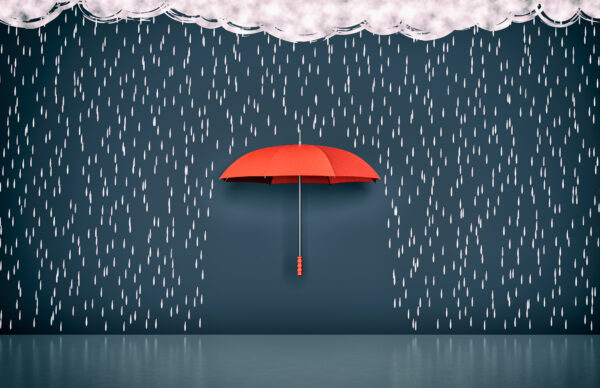 Security concept, a red umbrella protecting from the rain