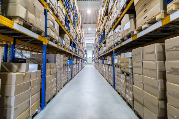 Storage warehouse with boxes piled on shelves