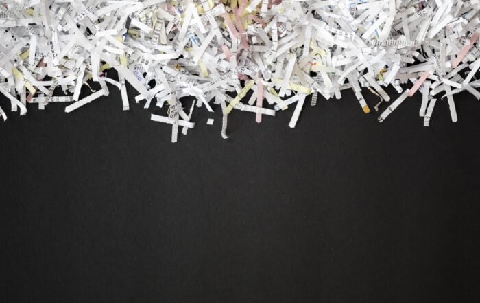 Shredded documents on a black background