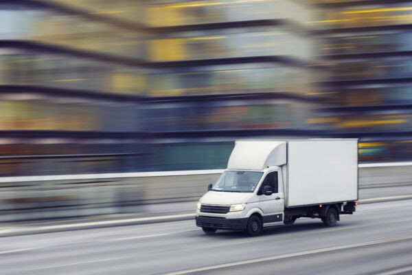 Delivery truck going fast on a freeway