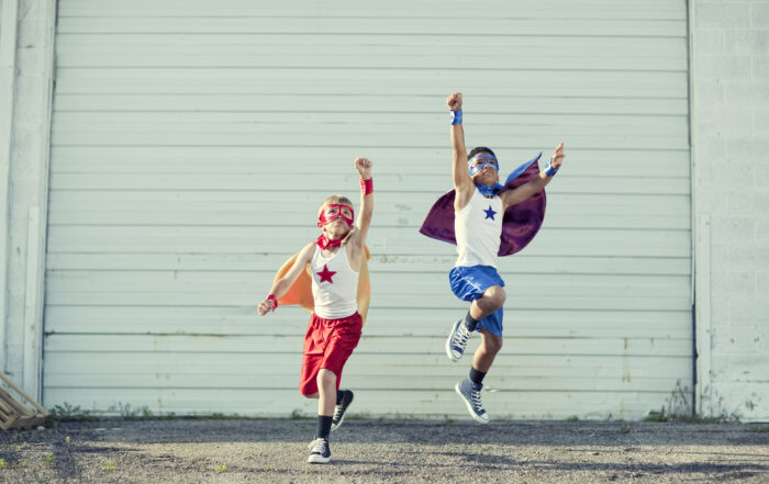 Two boys dressed as superheroes