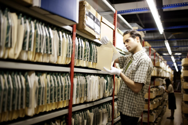 archivist handing records