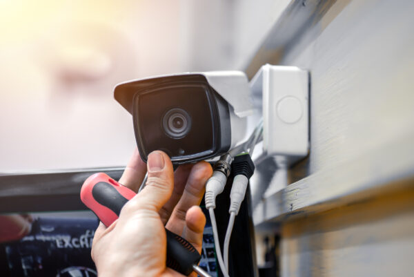 Close up of a surveillance camera being installed