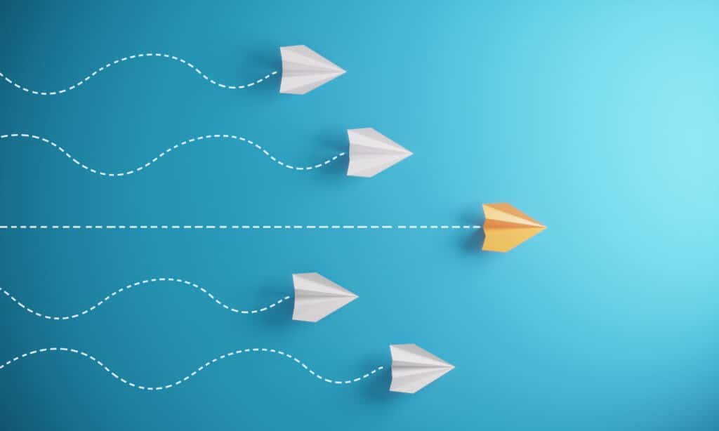 Leadership Concept With Paper Airplanes Group of paper airplanes, orange one is the first place, can be used leadership/individuality concepts. ( 3d render )