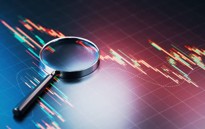 Magnifying Glass on Financial Chart Background
